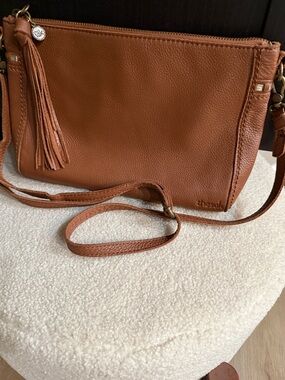 The Sak “Happy & Free” Crossbody Bag in Cognac Brown with Tassel